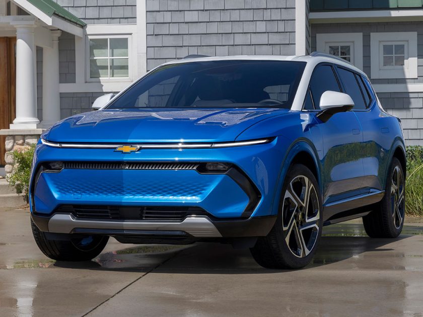 Seven-eighths view of 2024 Chevrolet Equinox EV 3LT in Riptide Blue parked in front of a home. Preproduction model shown. Actual production model may vary. 2024 Chevrolet Equinox EV available Fall 2023.